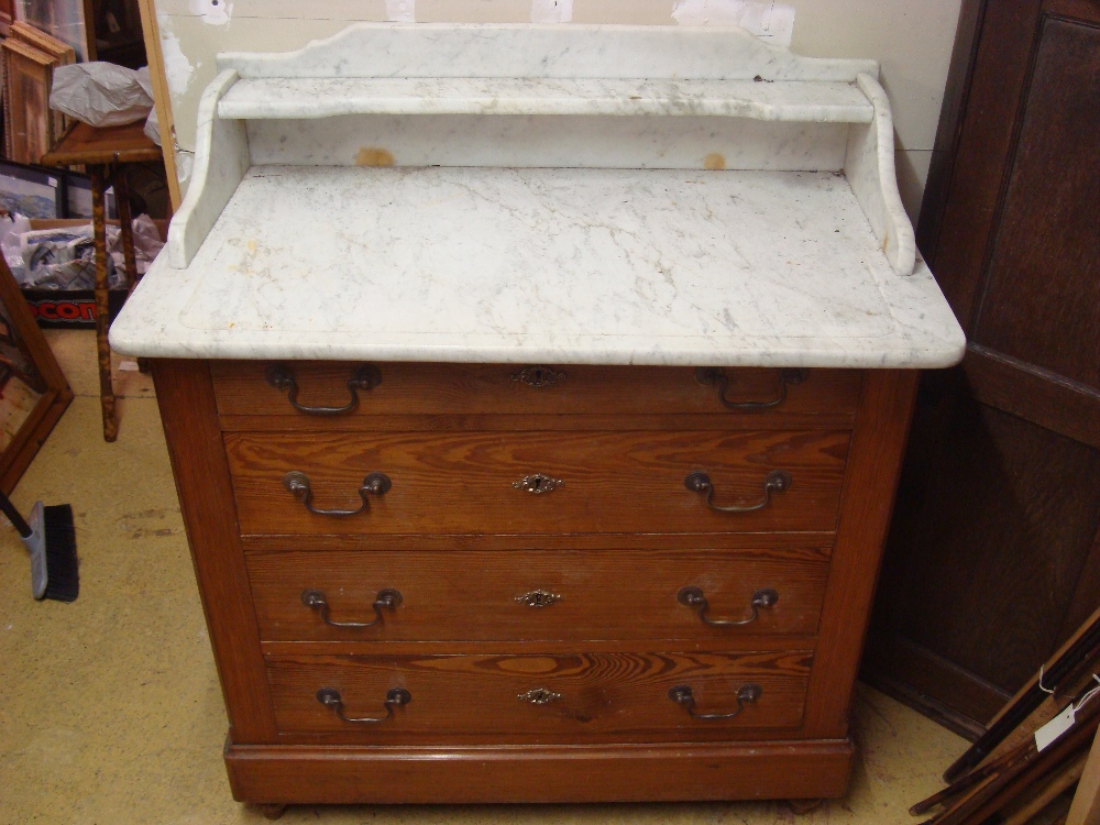 A late 19th Century marble topped washstand / chest of drawers with four drawers.