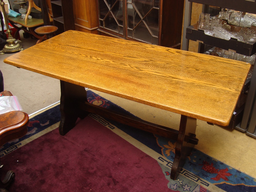 A reproduction Queen Anne style oak side table, the three plank top above a frieze drawer,