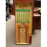 A wooden funfair sign, 'Bagatelle" style game. 118 x 46cm, a/f. Ball striker and balls missing.