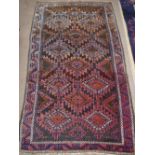 A large Balouch rug. 151x277cm.