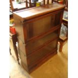 A three section Globe Wernicke bookcase, on plinth with drawer.