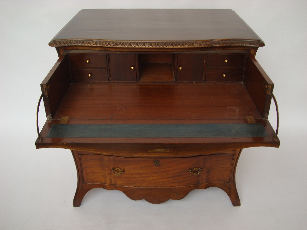 A George III style bombe shaped secretaire chest of drawers,