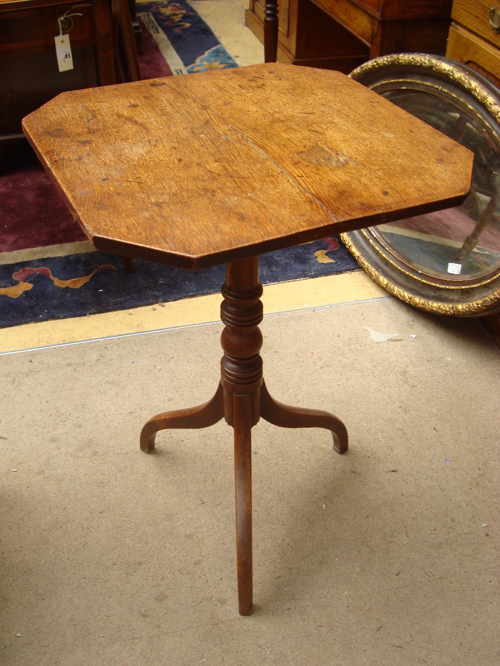 An early 19th Century oak and elm tripod table,