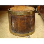 A part 19th Century brass bound barrel converted to a stool with cupboard.