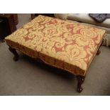 A large 20th Century upholstered cabriole legged footstool.