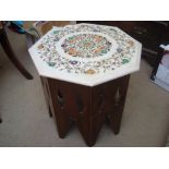 A Middle Eastern marble topped octagonal table.