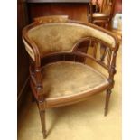 An Edwardian rosewood and marquetry inlaid tub armchair with padded back and seat,