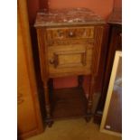 An early 20th Century oak marble topped bedside cabinet/pot cupboard.