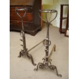 A pair of 18th Century steel crescent topped and irons. 73cm high.