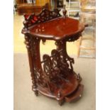 A mahogany reproduction 19th Century style music/magazine rack with upper tier.