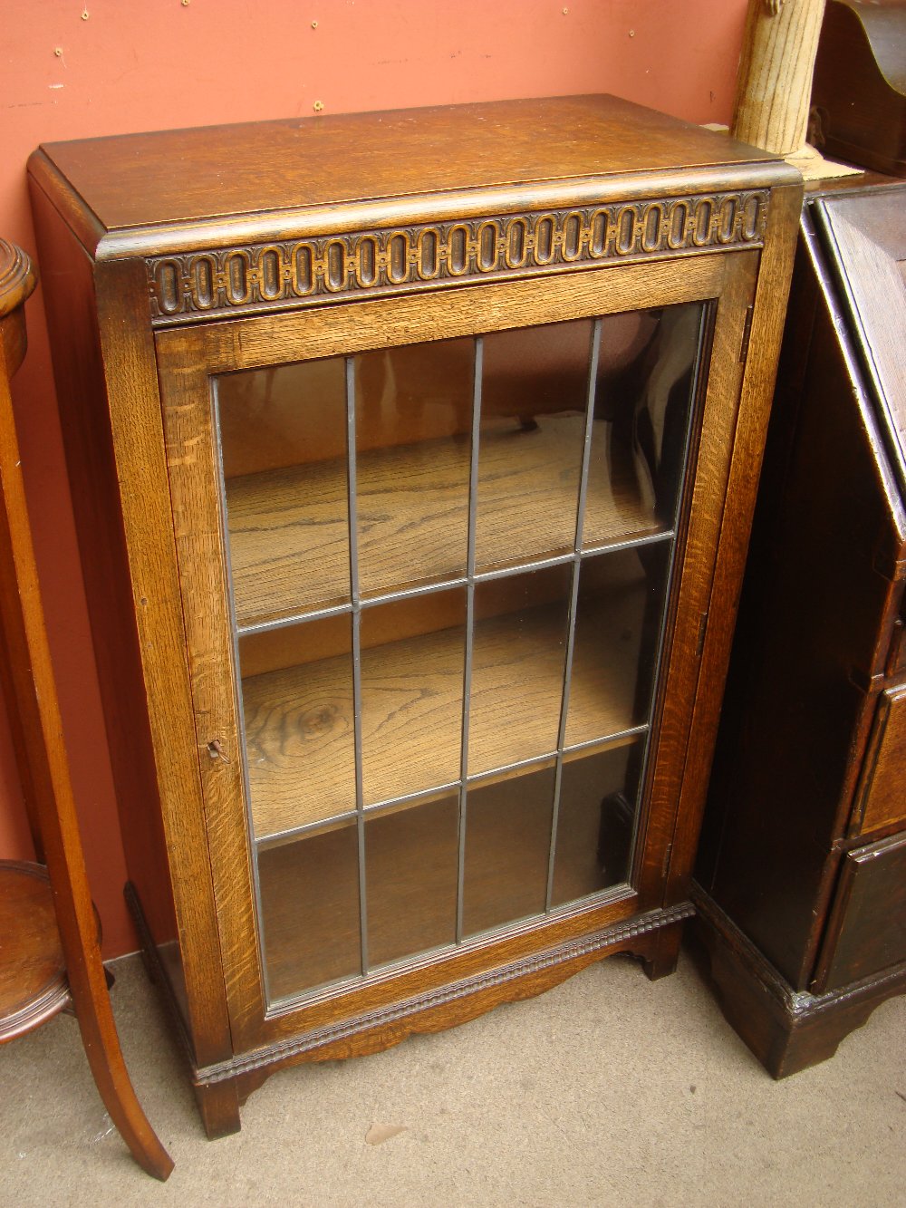 A 1930's glass fronted bookcase.