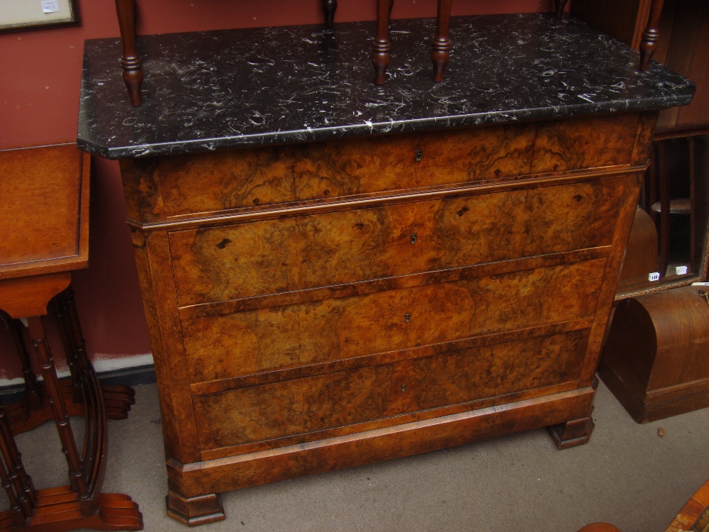 A 19th Century French marble topped walnut chest of four long drawers.