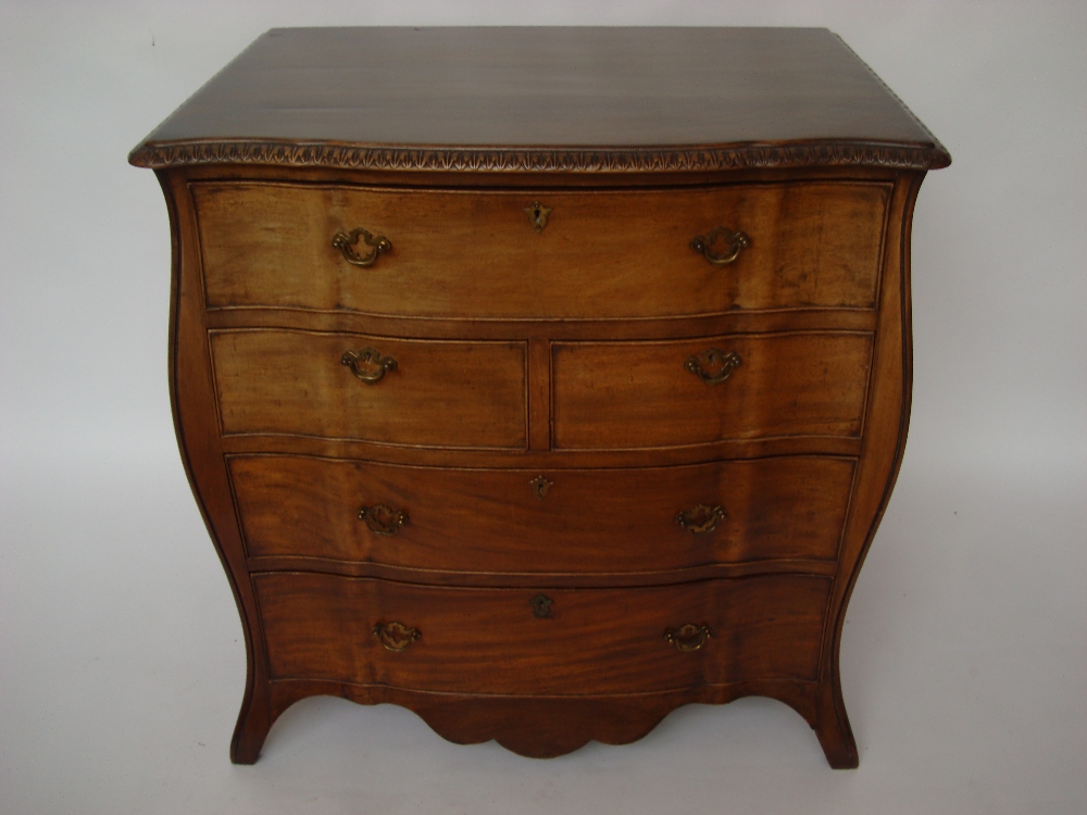 A George III style bombe shaped secretaire chest of drawers,