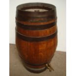 A coppered sherry barrel with spigot.