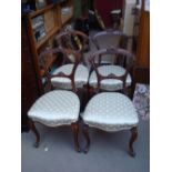 Four 19th Century walnut salon chairs, with cabriole legs.