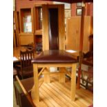 Four 20th Century oak and leather dining chairs.