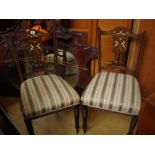 Two inlaid Edwardian side chairs.