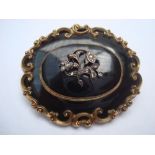 A 19th Century mourning brooch inscribed "Edward S Lumb died 16th April 1844 aged 13".