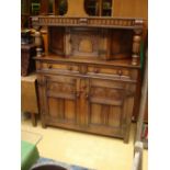 A 1930's Jacobethan oak court cupboard.