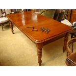 A late Victorian extending wind out dining table.