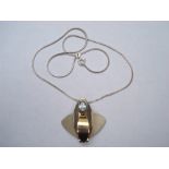 A silver and 9ct white gold pendant and chain, signed verso ? Grima 2001.