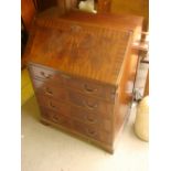 A 20th Century full front bureau with four drawers, writing compartment, pigeon holes,