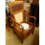 A 19th Century armchair commode.