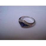 An 18ct white gold ring, the sapphires surrounded by diamonds.