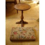 A 20th Century oak low table with a pad footed tapestry footstool.