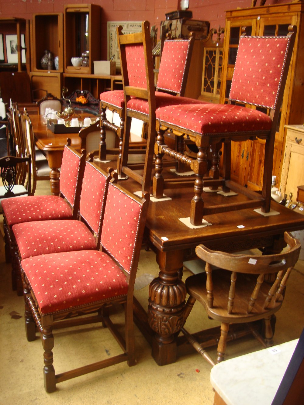 Six upholstered oak dining chairs.