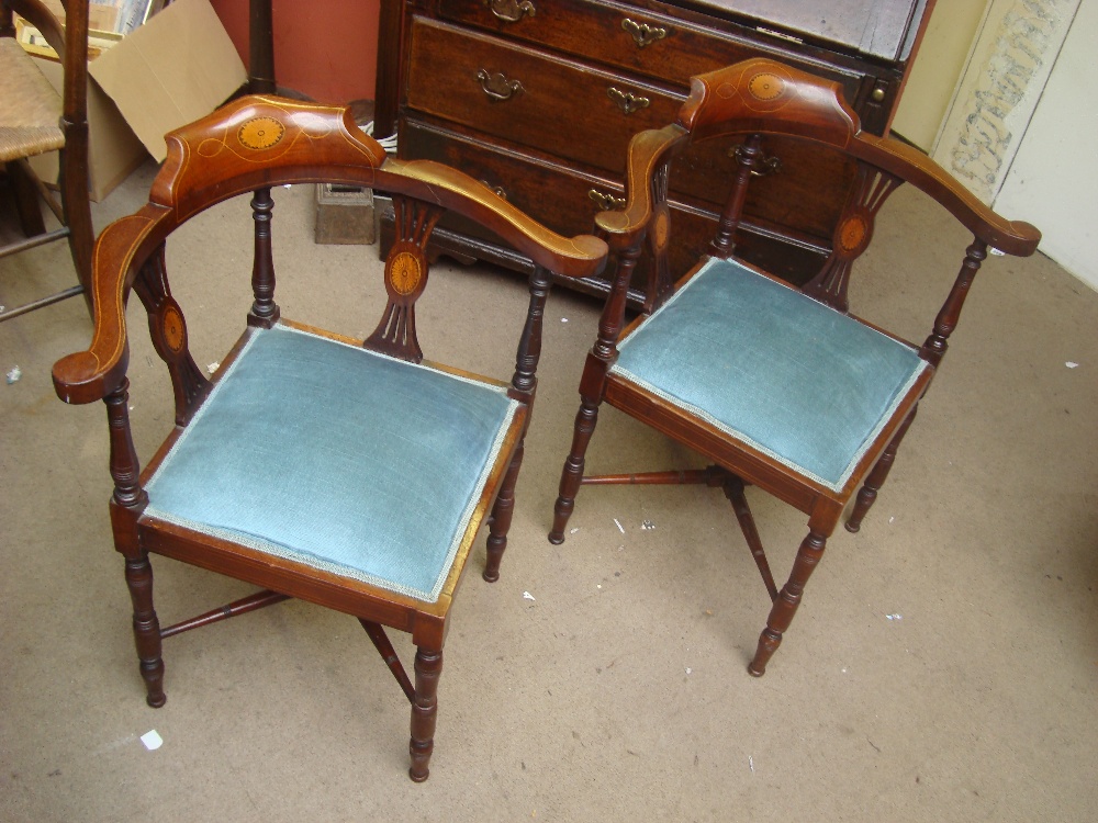 Two Edwardian inlaid corner chairs.