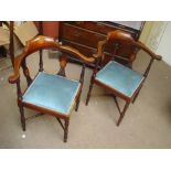 Two Edwardian inlaid corner chairs.