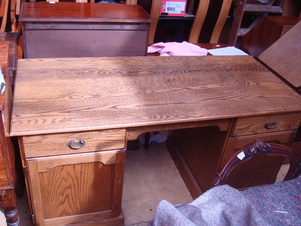 A seven drawer 1920's oak office desk.