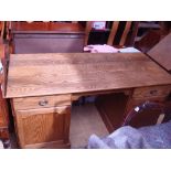 A seven drawer 1920's oak office desk.
