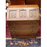 A 1930's oak fall front bureau.