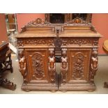 A pair of heavily carved 19th Century Continental night cupboards.