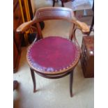 An early 20th Century J & J Kohl beech bentwood circular open elbow armchair,