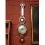 A 19th Century rosewood wheel barometer, with silvered dial, damp/dry scale,