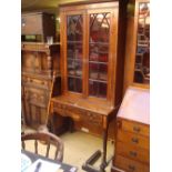 A mahogany astragal glazed bookcase on stand, satinwood banded and inlaid with fan marquetry,