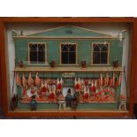 A diorama of a butchers shop in glazed display case.