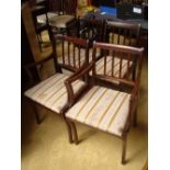 Four reproduction mahogany dining chairs.