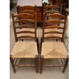 A set of four 19th Century rush seated ladderback chairs.