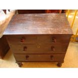 A small Victorian stained pine chest of drawers with two short and two graduated long drawers with