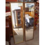 Two long gilt framed mirrors.