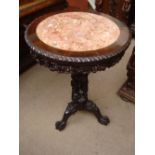 A 19th Century Chinese rosewood circular occasional table with inset marble top.