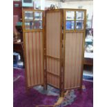 A Victorian gilt wood three fold room screen, with fabric lined and bevelled glass panels.