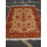 A beige ground Ziegler style carpet. 230 x 160cm.