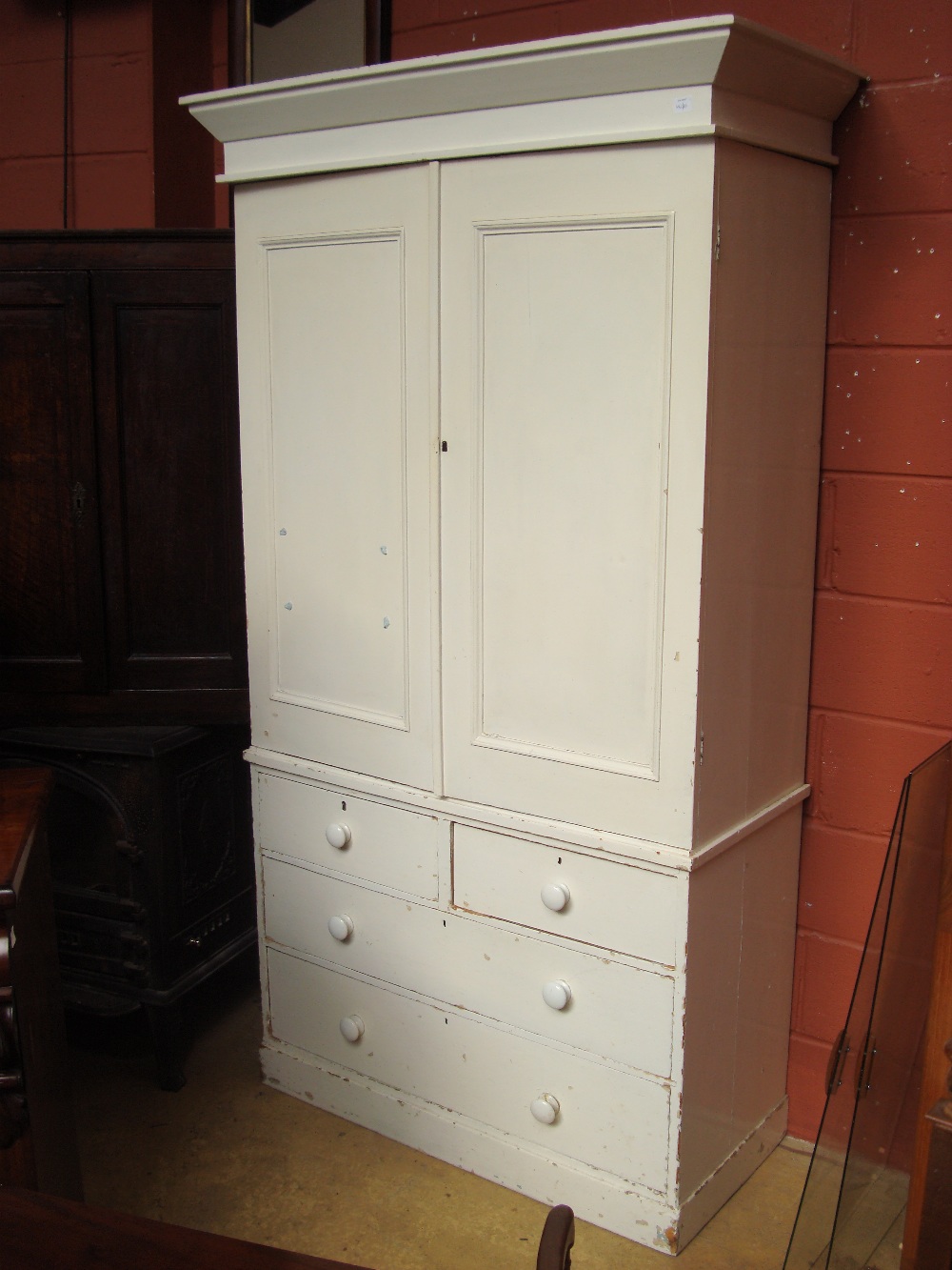 A Victorian white painted pine house keepers cupboard,