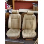 Two leather upholstered Jaguar seats.