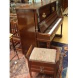 An Aeolian Pianola piano with working movement and a collection of music rolls, with stool.